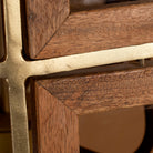 Close up image of a octagon-shaped wooden pendant lamp with antique brass accents – handcrafted wooden lamp for industrial style lighting in dining or living spaces.