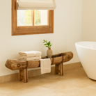 Lifestle imagination of a antique console table repurposed from reclaimed teak wood feeding trough with carved details and iron fittings; unique furniture ideal for rustic interiors, compatible with teak wood benches, 234 × 31 × 61 cm.