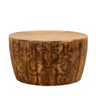 White background view of a elegant round hand carved coffee table made of sustainable Mango wood with floral design.