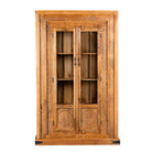 White background image of a hand carved display cabinet made from natural mango wood with floral detailing and glass-panelled doors; 180 × 110 × 40 cm.