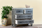 Side angle image with open drawers of a of a hand-painted Indian chest of drawers made from recycled wood – unique furniture featuring colourful motifs and antique craftsmanship.
