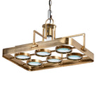 White background image of a unique pendant light with brass-plated iron square frame and magnifying blue and white glass inserts – vintage lighting piece ideal for kitchens, living rooms, or entryways.