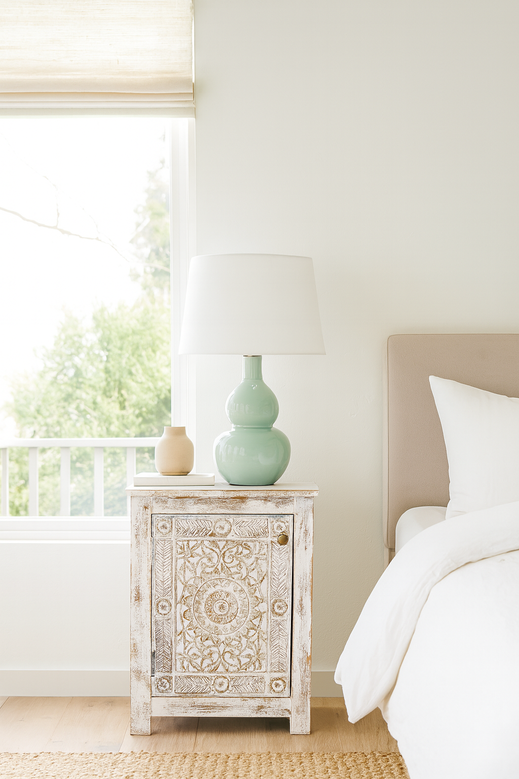 Lifestyle imagination of a set of two hand carved bedside tables with mandala and floral motifs; reclaimed wood in white washed furniture style, 50 × 40 × 72 cm.