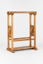 White background image of a wooden towel rack made from recycled teak wood with wave-shaped carved design; rustic bathroom furniture, 100 × 30 × 76 cm.