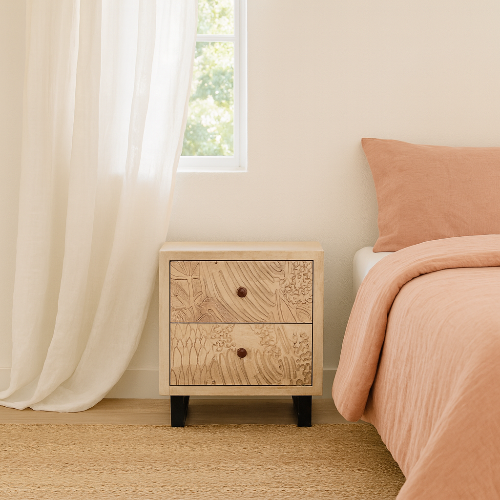 Lifestyle imagination of a pair of mango wood nightstands with hand-carved sandblasted finish and black iron stand; artisanal bedroom furniture, 51 × 41 × 59 cm.