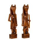 White background image of a hand-carved Indian house guardian statue in exotic style, made from reclaimed wood; sustainable furniture, 40 × 20 × 120 cm.