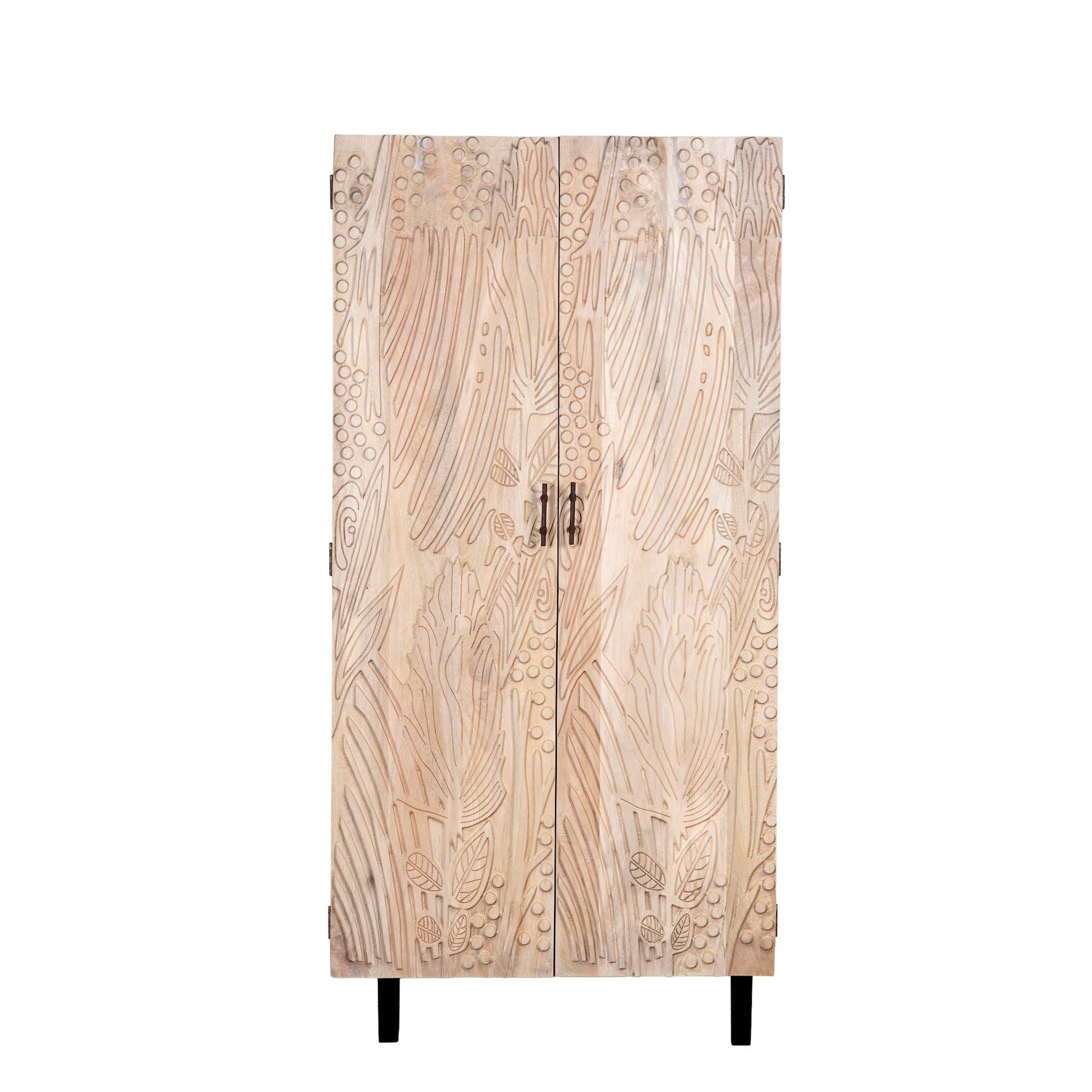 White background image of a hand-carved mango wood wardrobe with sandblasted finish and iron stand; artisanal bedroom furniture, 90 × 46 × 183 cm.