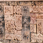 Close up image of a reclaimed teak console table with hand-carved antique elements and rustic finish, 140 × 38 × 93 cm.