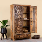 Open door image of a hand-carved mango wood wardrobe, a unique wooden furniture piece inspired by traditional Indian furniture craftsmanship.