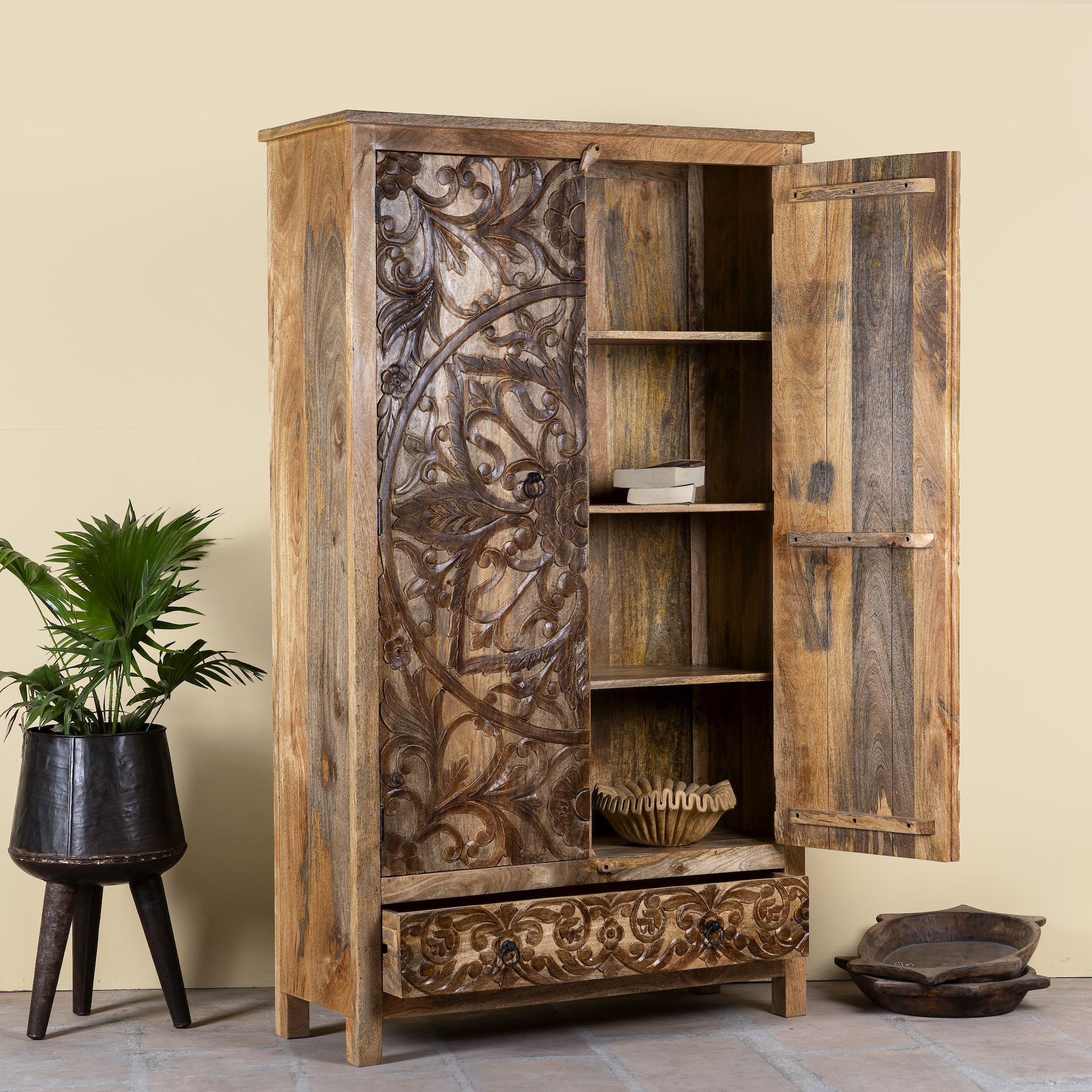 Open door image of a hand-carved mango wood wardrobe, a unique wooden furniture piece inspired by traditional Indian furniture craftsmanship.
