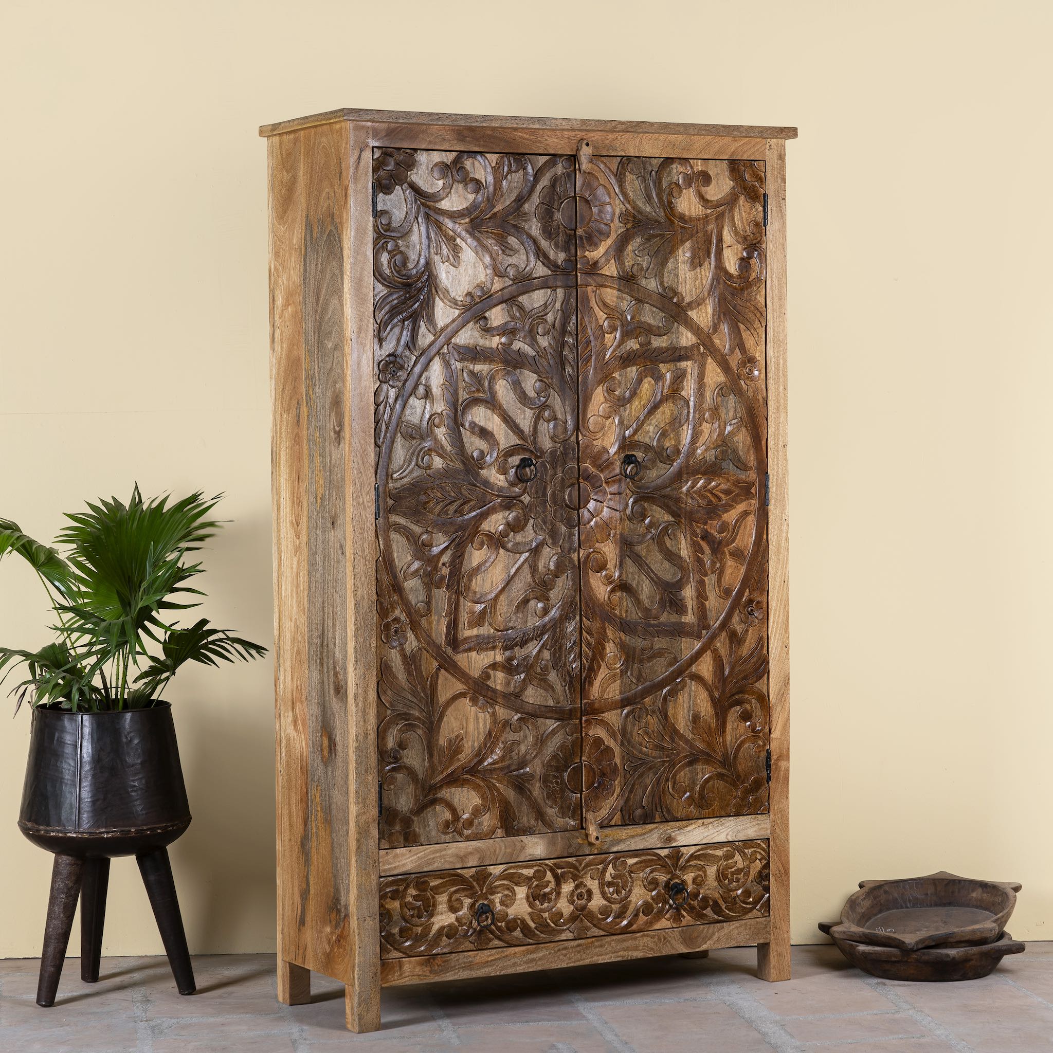 Side angle image of a hand-carved mango wood wardrobe, a unique wooden furniture piece inspired by traditional Indian furniture craftsmanship.