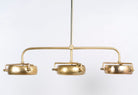 Elongated vintage pendant lamp with brass-plated frame and three clear glass shades – artsy lighting ideal for kitchens, dining rooms, or entryways.