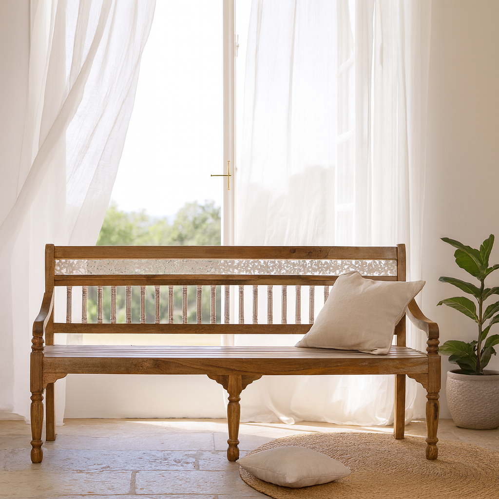 Lifestyle imagination of a hand carved mango wood bench with floral backrest and spindle accents; rustic mango wood seating, 176 × 56 × 95 cm.