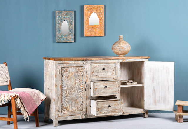 Open door image of a handcrafted carved sideboard made from solid mango wood with floral motifs, antique layered finish, and natural wood top; artisan vintage furniture, 150 × 40 × 90 cm.