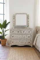 Lifestyle imagination of a of a hand-painted dressing table with mirror made of reclaimed wood – Meira model by Om Home & Garden