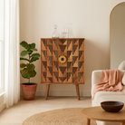 Lifestyle imagination of a artisanal mango wood cabinet with natural doors, black frame, and brass knobs, 91 × 113 × 41 cm.