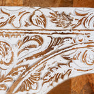 Close up image of a mango wood furniture cabinet with full front floral carving, artisanal bedroom furniture with hand-carved details, 180 × 90 × 40 cm.