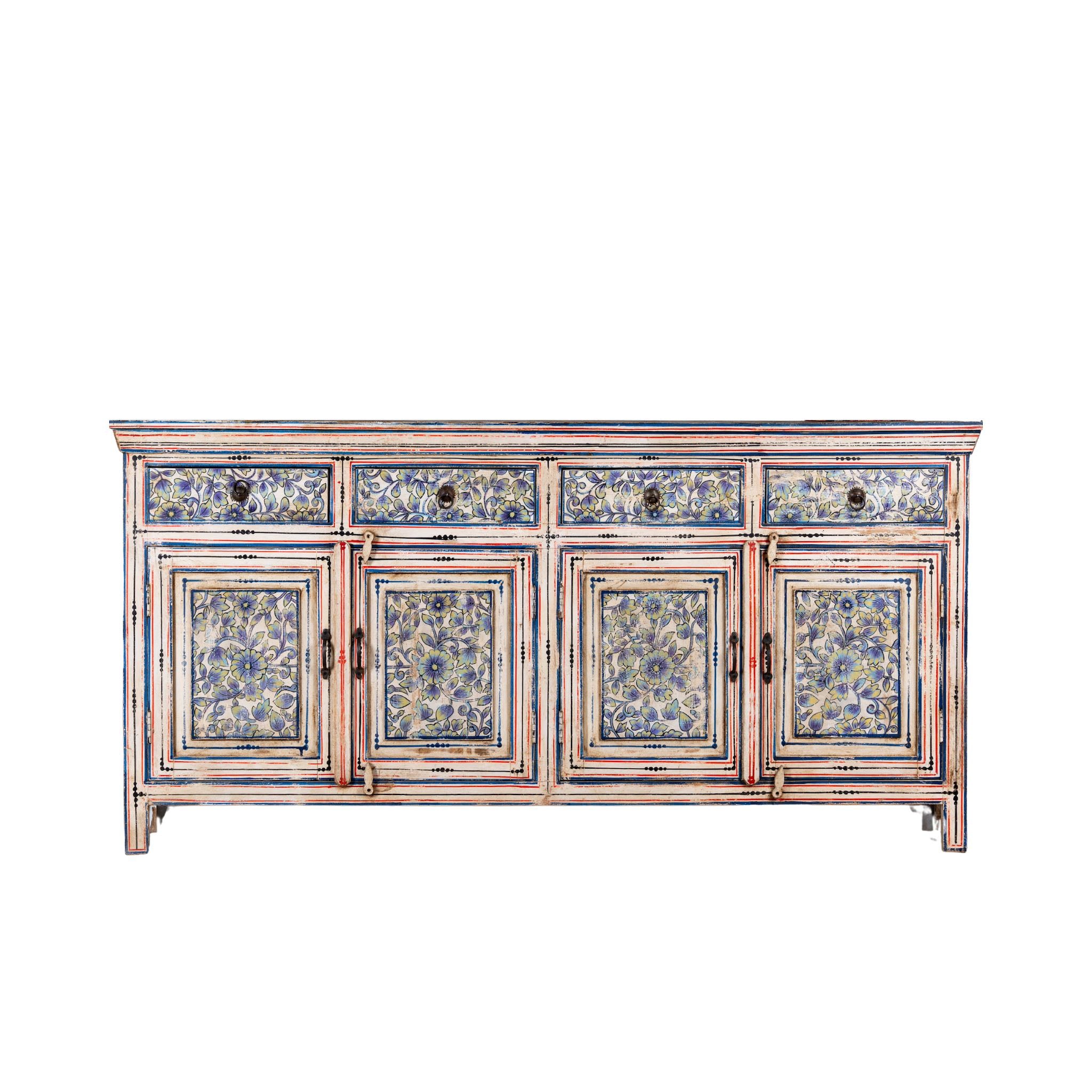 White background image of a vintage hand-painted floral sideboard with reclaimed wood frame, blue and yellow floral designs, and distressed multicolour detailing.