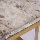 Close up image of a square metal coffee table with brown marble top and copper-finished iron base; marble top coffee table, 76 × 76 × 46 cm.