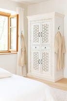 Hand-carved mango wood cabinet with shelving and whitewashed finish, bedroom furniture with floral and geometric motifs, 190 × 105 × 40 cm.