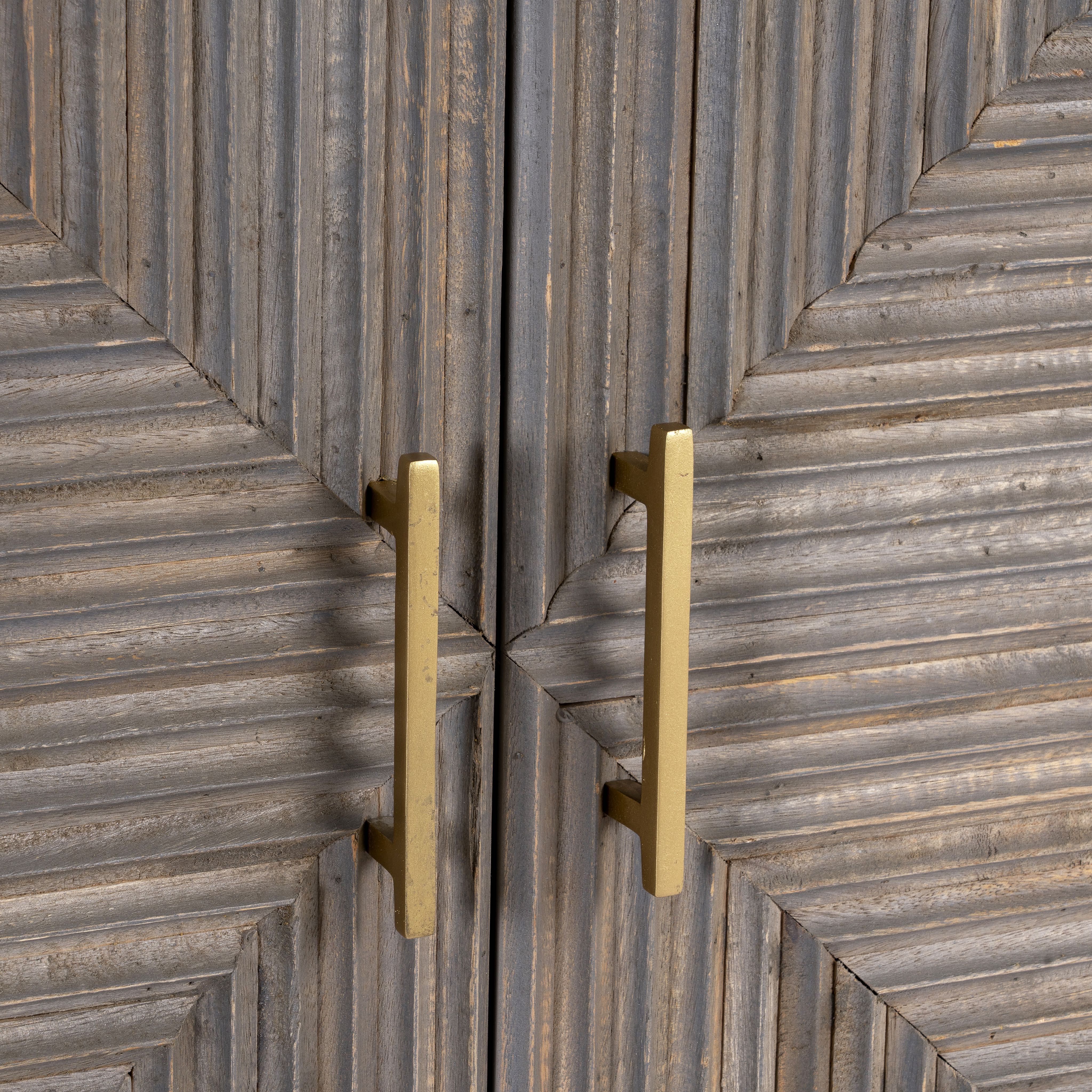 Detail view of Sahishnu sideboard showing hand-carved linear engravings and wood texture