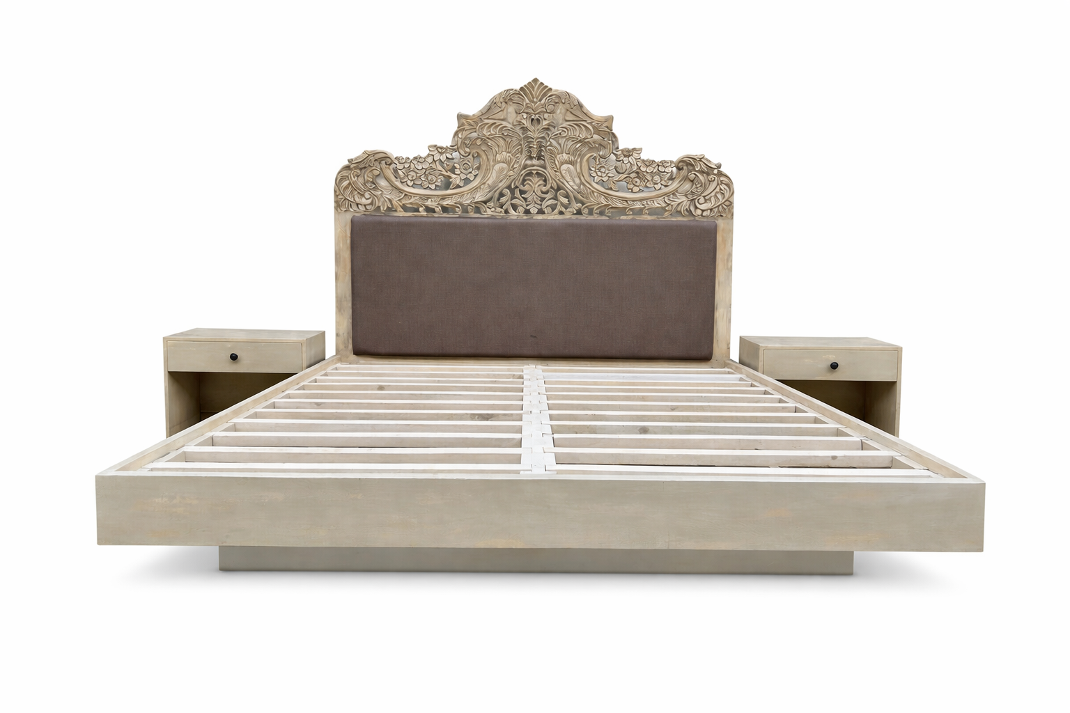 White background image of a hand-carved vintage bed Samar made from distressed mango wood, featuring an ornate high headboard with soft grey fabric upholstery. A unique blend of Indian craftsmanship and contemporary comfort in a natural, neutral palette.
