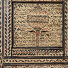 Close up image of a hand-painted display cabinet made from recycled wood with glass doors – sustainable furniture featuring Sanskrit motifs and traditional Indian craftsmanship.