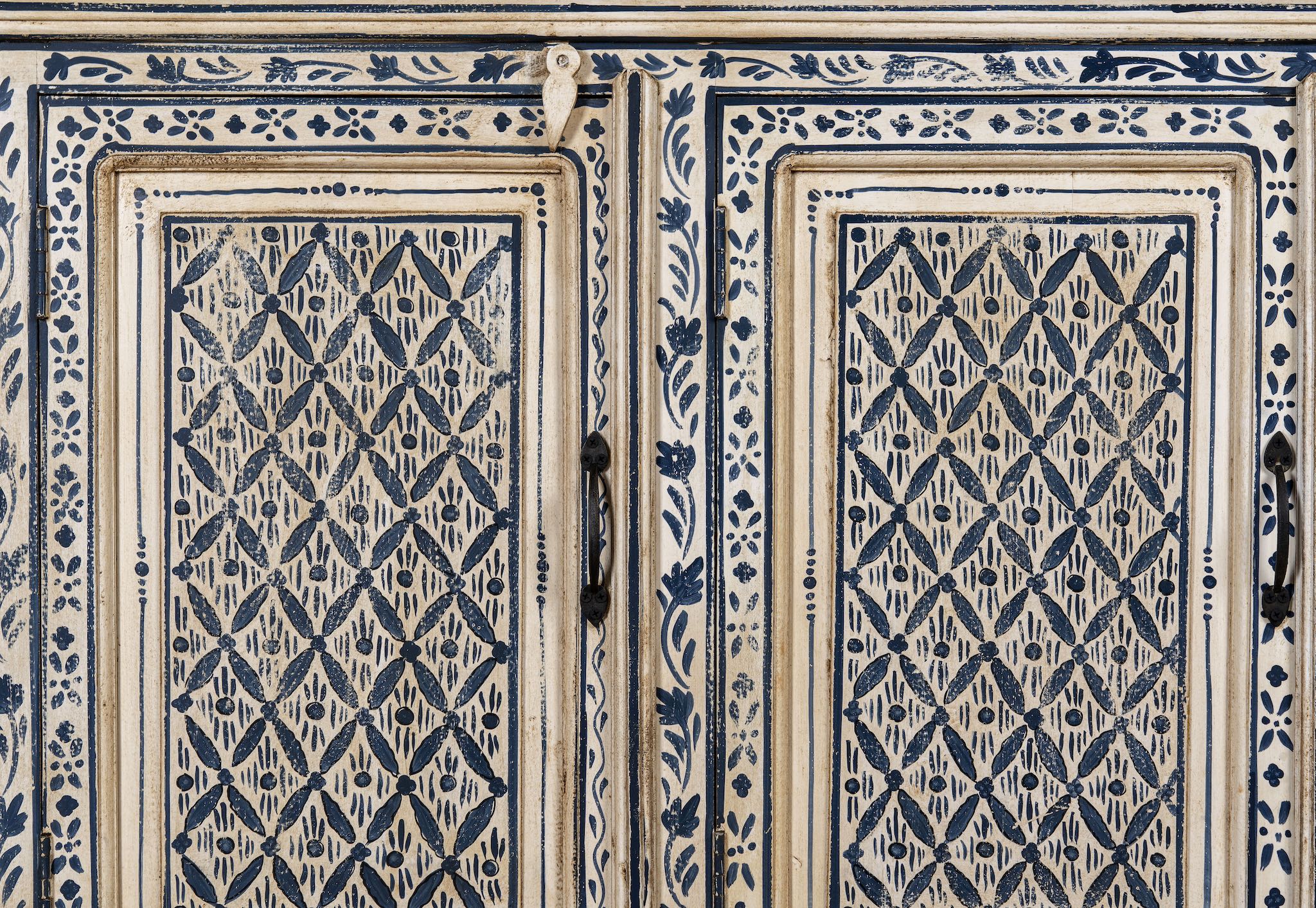Close up image of a hand-painted sideboard made from reclaimed wood in indigo and cream tones – a handcrafted piece of reclaimed wood furniture perfect for hand painted interiors.