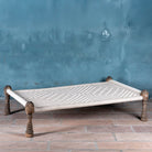 Handwoven Indian Charpai bed with reclaimed teak frame and carved legs; perfect for Indian home decor, 170 × 105 × 45 cm.