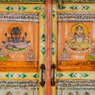 Close up image of a hand painted reclaimed wood furniture cabinet with Indian god motifs, vintage furniture with cultural detailing, 90 × 40 × 150 cm.