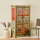 Side angle image of a hand painted reclaimed wood furniture cabinet with Indian god motifs, vintage furniture with cultural detailing, 90 × 40 × 150 cm.