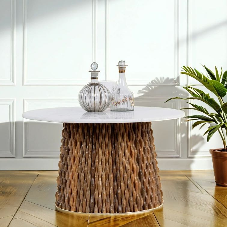 Lifestyle imagination of a round marble top coffee table with handcrafted mango wood base in strip design; wooden base coffee table, 80 cm diameter, 44 cm height.