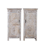 White background image of a white washed wood cabinet with hand-carved floral design, Moroccan-style reclaimed wood furniture, 134 × 60 × 45 cm.