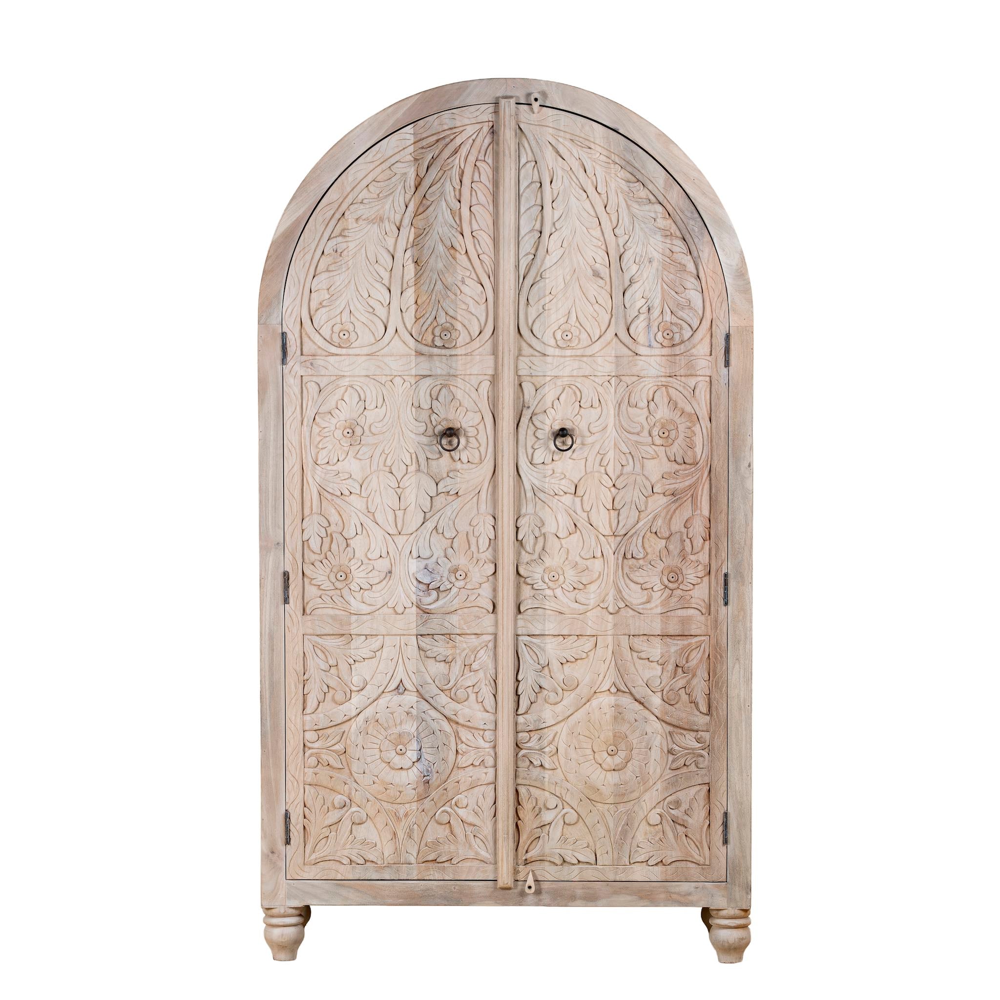 Decorative wooden armoire with intricate carvings on a white background