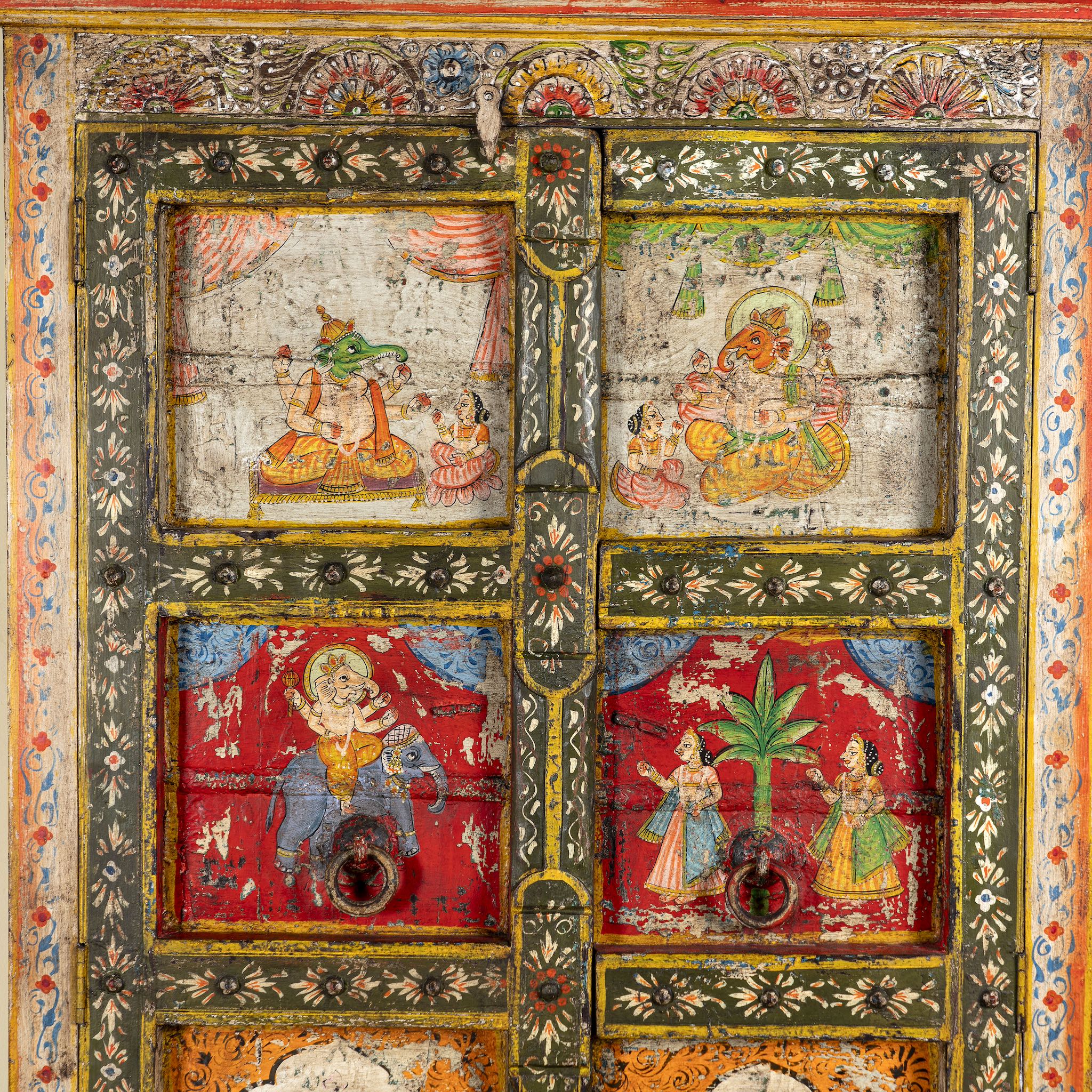 Close up image of a hand painted teak wood cabinet with floral motifs, restored Indian furniture online; unique storage piece, 100 × 44 × 185 cm.