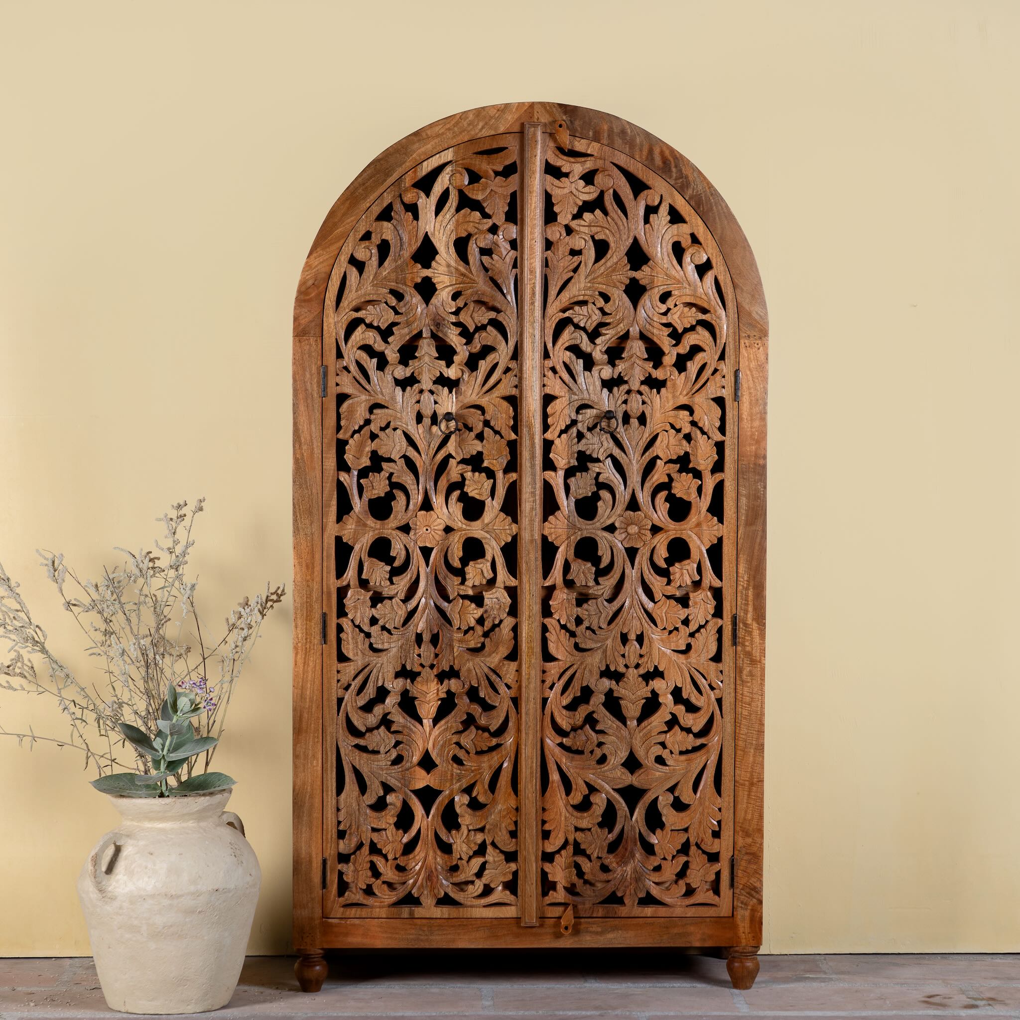 Hand carved wooden wardrobe with arc-shaped cabinet design in solid mango wood – Aranya model by Om Home & Garden
