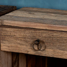 Close up image of a pair of bedside tables in Driftwood/ Wabi Sabi style crafted from recycled old wood, each featuring a single drawer with a metal ring pull and an open shelf below, showcasing natural wood grain and rustic textures.


