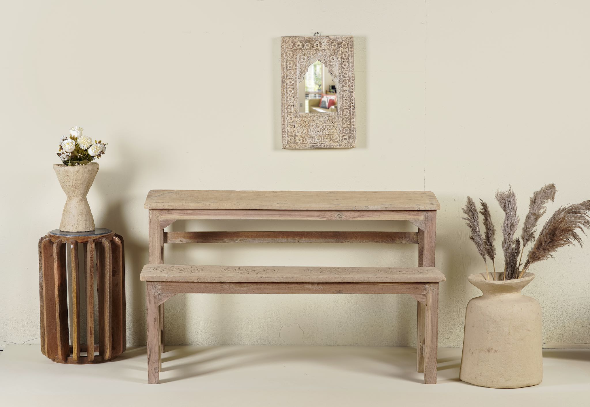 Vintage school bench set from India, crafted from old teak wood, featuring a simple, sturdy design with a long bench and matching table in a natural, weathered finish, styled in a neutral-toned interior with rustic decor accents.
