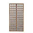 White background picture of a wall mirror crafted from an old teak window frame with a fine grid of small mirrored panes and rustic metal accents, blending heritage with minimalist design.