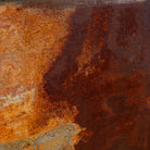 Close-up image of a rusted iron wall panel framed in teak wood with naturally formed abstract patterns – a unique iron wall decoration perfect for modern and industrial spaces.