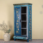 Side angle image of a hand-painted wardrobe made of reclaimed wood in vibrant blue floral design – Yuvika model by Om Home & Garden