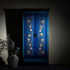Artsy image of a hand-painted wardrobe made of reclaimed wood in vibrant blue floral design – Yuvika model by Om Home & Garden