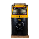 Unique bar table crafted from the front part of an old Indian rickshaw, featuring vibrant yellow and black paint with original details and functioning light.