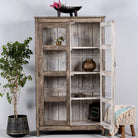 Open door image of a handcrafted display cabinet made from reclaimed Teak wood with glass doors and Sanskrit motifs; sustainable and unique wooden furniture, 182 × 93 × 42 cm.