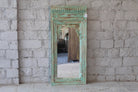 Warehouse image of a Hand carved wooden mirror made from antique Indian window frame, vintage green finish; 145 × 70 × 10 cm.
