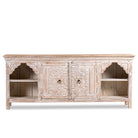 White background image of a hand-carved mango wood Mediterranean lowboard with floral engravings and whitewashed finish – carved wooden furniture combining traditional Indian craftsmanship with rustic elegance.