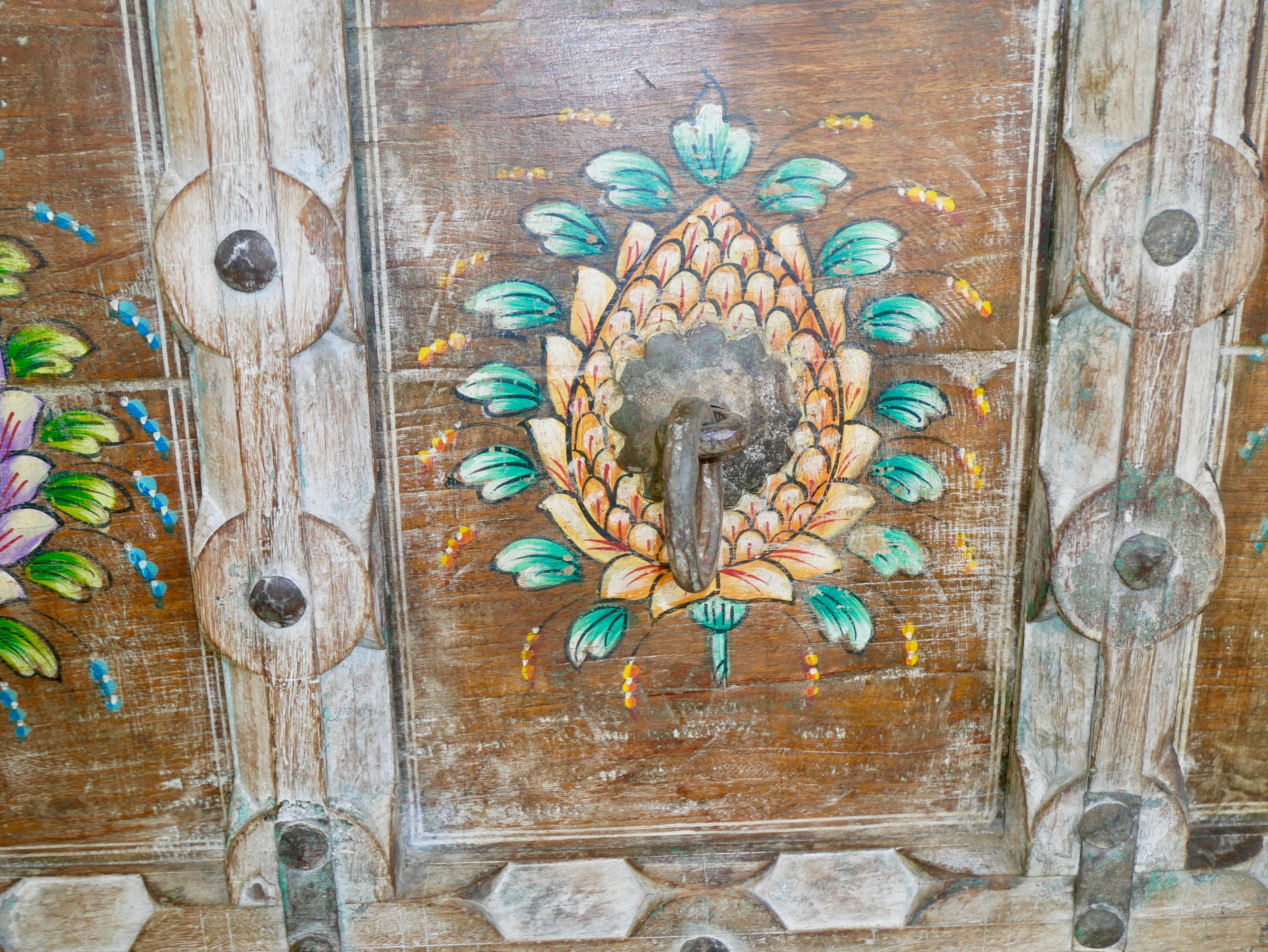 Close up image of a teak wood console table made from recycled antique house parts with hand-painted front; sustainable furniture, 183 × 85 × 42 cm.