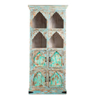 White background image of a hand-carved mango wood shelf with arched open display and lower cabinets – vintage home decoration piece in distressed pastel blue finish with Indian architectural detailing.