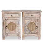 White background image of a pair of hand carved mango wood night stands with rattan inserts; sustainable bedroom furniture, 67 × 47 × 40 cm.