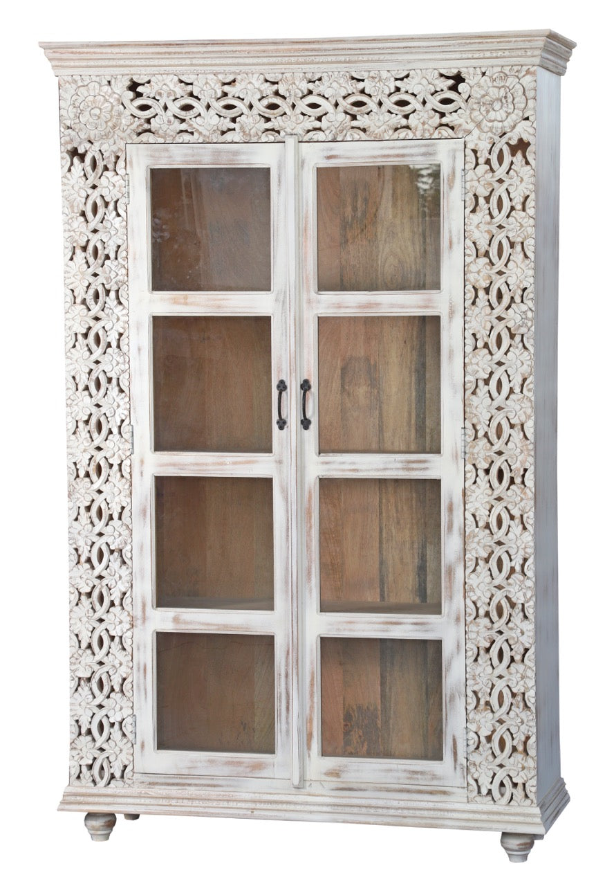 White background image of a handcrafted mango wood cabinet with glass-panelled doors and internal storage – carved wood furniture made from sustainable mango wood with unique natural grain.